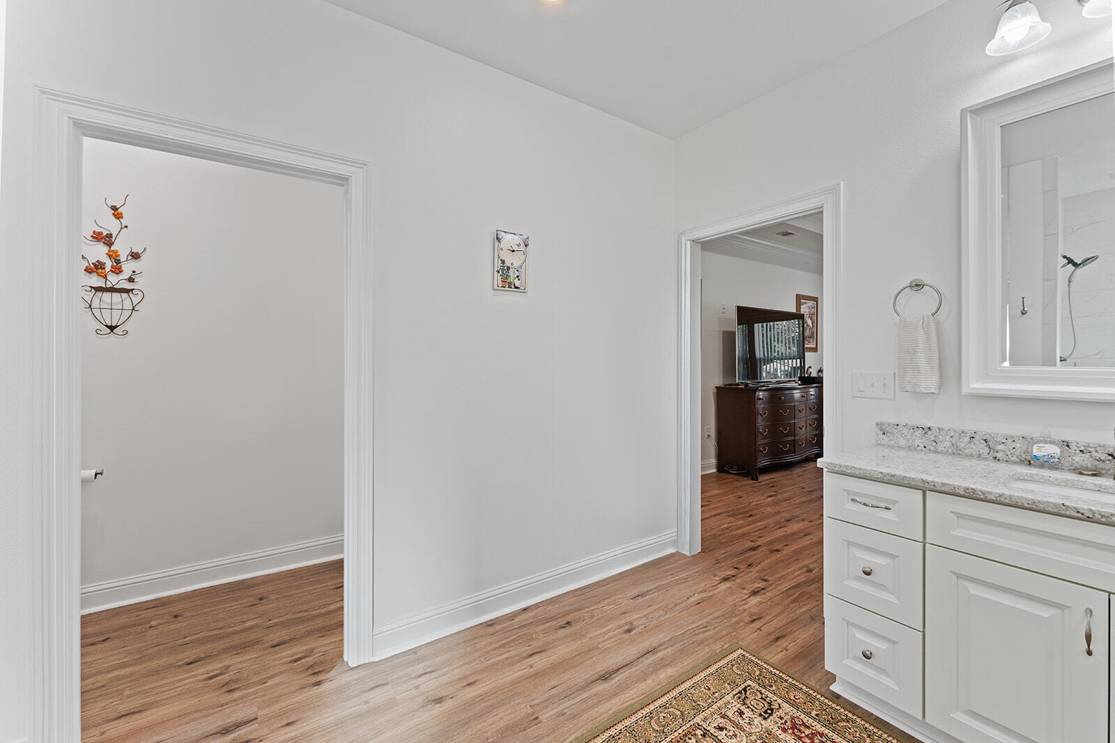 2944 Barton Road Crestview, FL 32539 - Photo 10 of 42 wooden floor with white cabinets and wooden floor