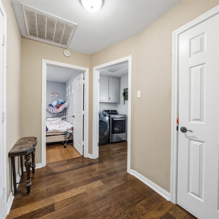 785 Tweedy Road Valley Mills, TX 76689 - Photo 13 of 40 Hallway with rich wood-finish flooring