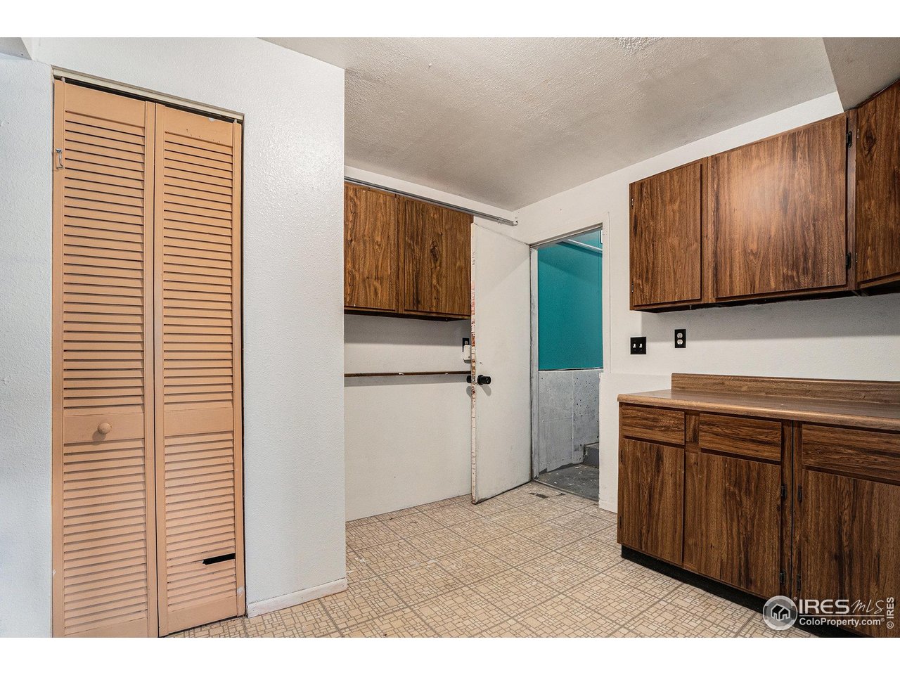 1240 3rd Street Eaton, CO 80615 - Photo 17 of 24 a kitchen with a refrigerator and a sink