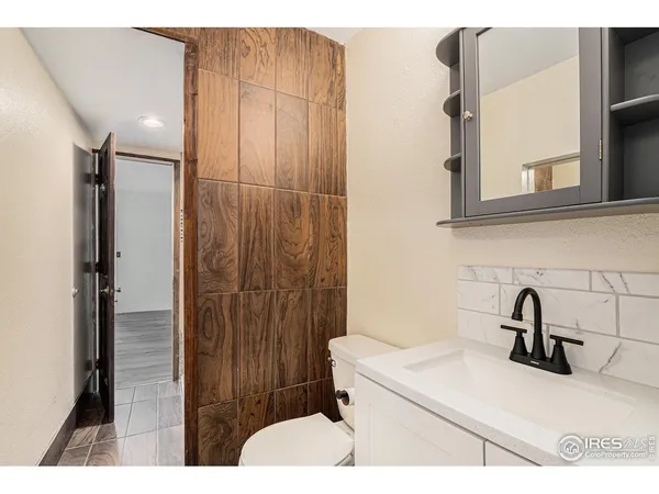 a bathroom with a sink and mirror