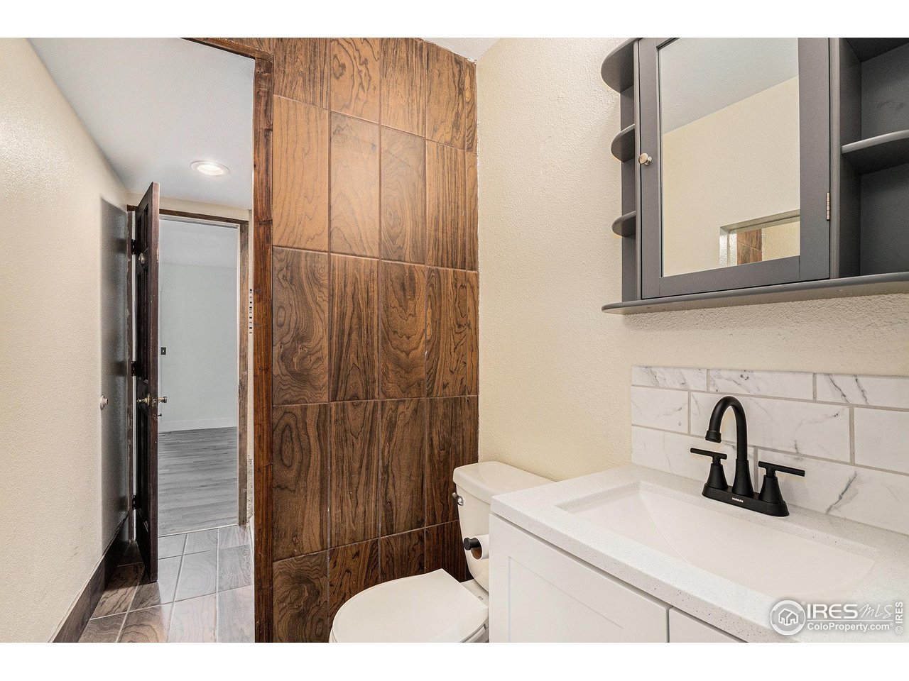 1240 3rd Street Eaton, CO 80615 - Photo 10 of 24 a bathroom with a sink and mirror