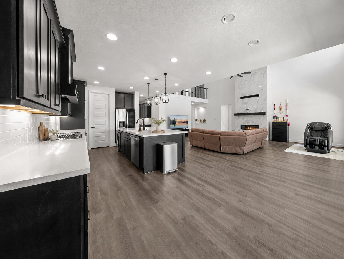 1440 Riva Ridge Drive Leander, TX 78641 - Photo 10 of 37 An open-concept living area offers an inviting flow between the kitchen and spacious great room, highlighted by high ceilings.