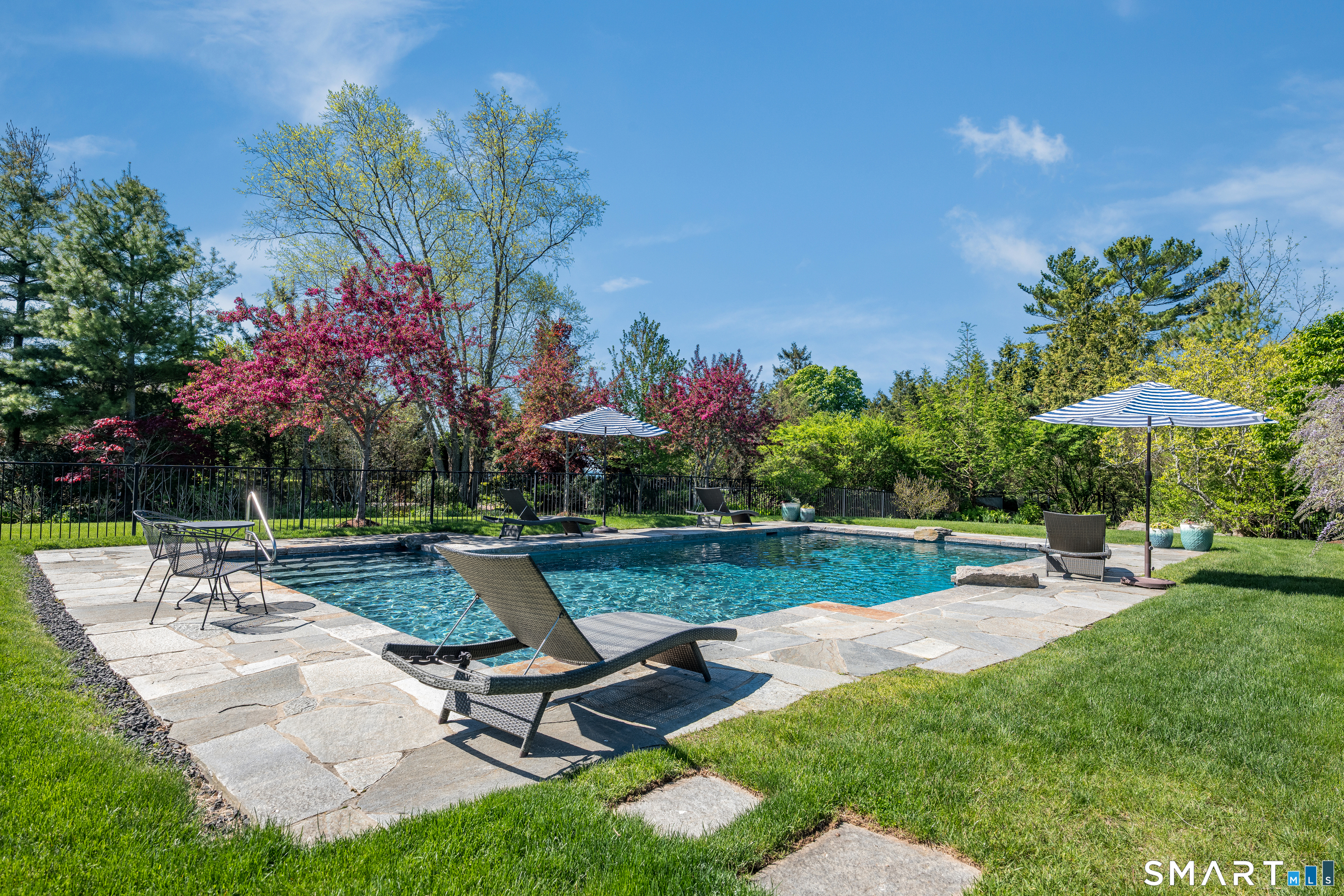 28 Walden Hill Road Guilford, CT 06437 - Photo 32 of 35 a view of a swimming pool and lounge chairs in back yard
