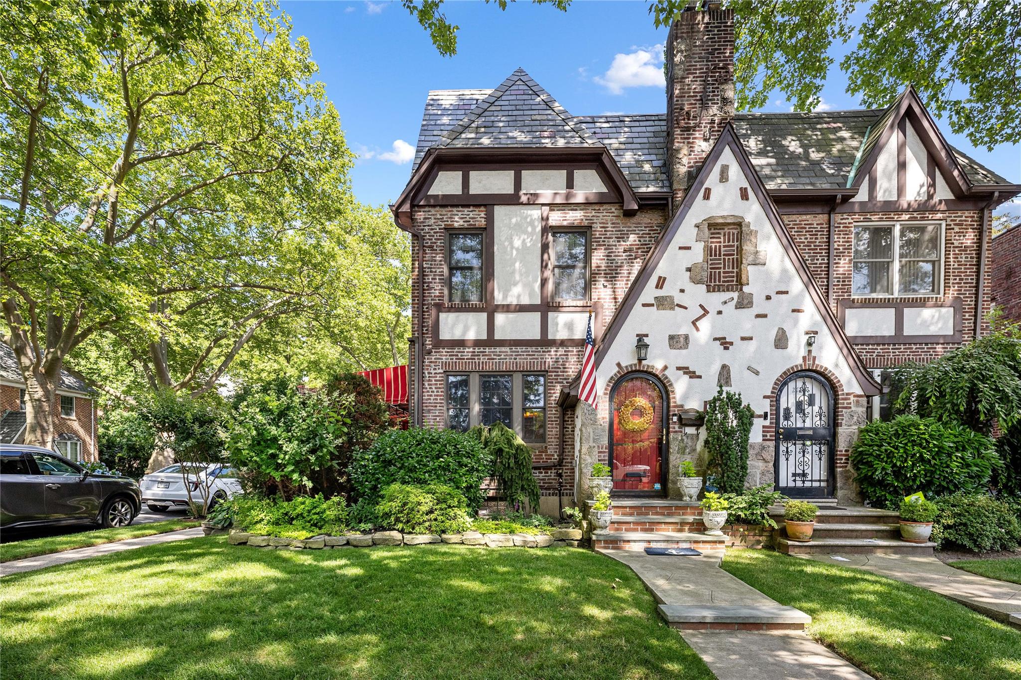 a front view of a house with garden