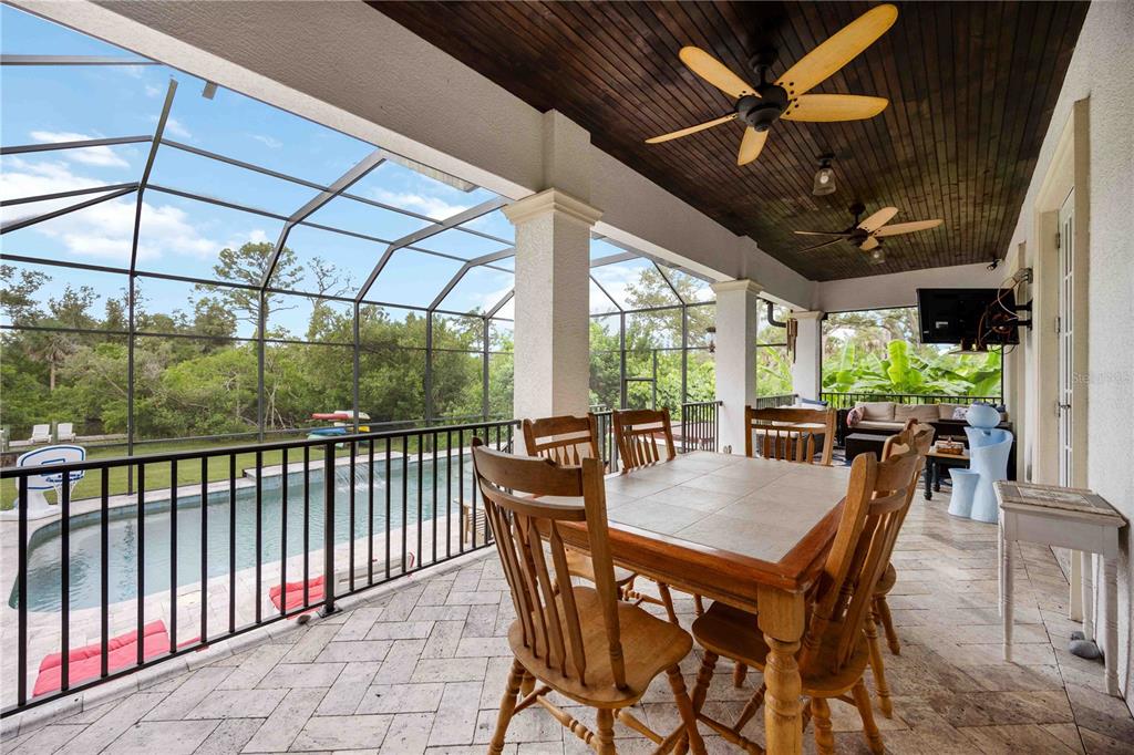 3674 Roslyn Road Venice, FL 34293 - Photo 12 of 72 a view of an outdoor dining space with furniture