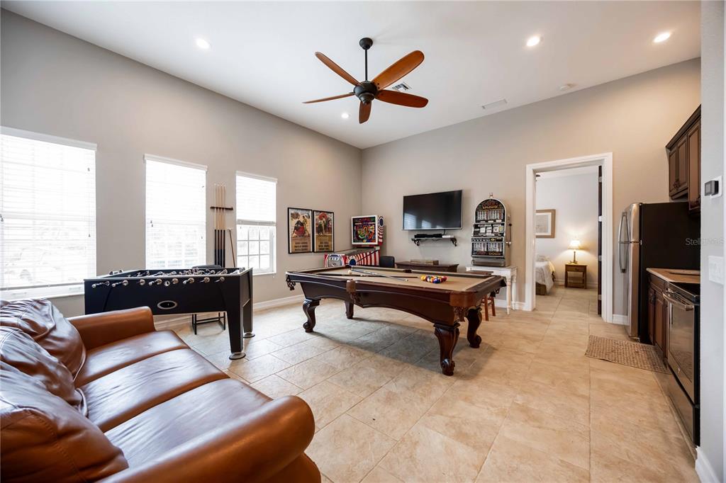 3674 Roslyn Road Venice, FL 34293 - Photo 19 of 72 a living room with furniture ceiling fan and a rug