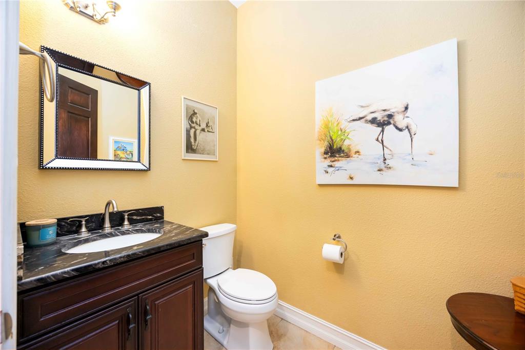 3674 Roslyn Road Venice, FL 34293 - Photo 42 of 72 a bathroom with a granite countertop sink and a toilet
