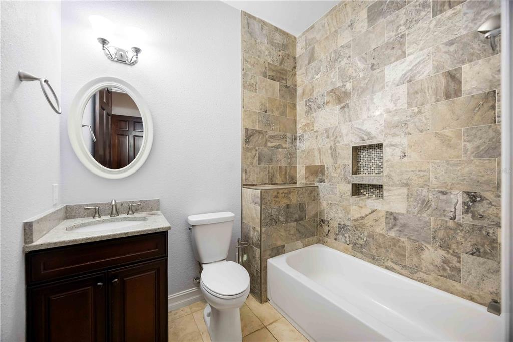 3674 Roslyn Road Venice, FL 34293 - Photo 46 of 72 a bathroom with a sink toilet and shower