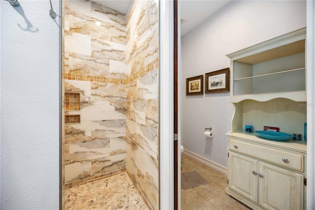 3674 Roslyn Road Venice, FL 34293 - Photo 55 of 72 a bathroom with a shower and a mirror