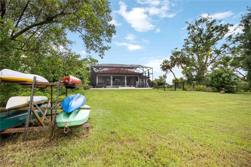 3674 Roslyn Road Venice, FL 34293 - Photo 61 of 72 a view of a house with backyard porch and sitting area