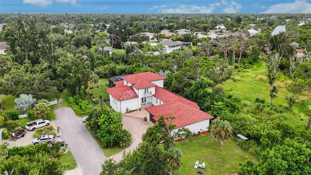 3674 Roslyn Road Venice, FL 34293 - Photo 63 of 72 an aerial view of a house with a yard