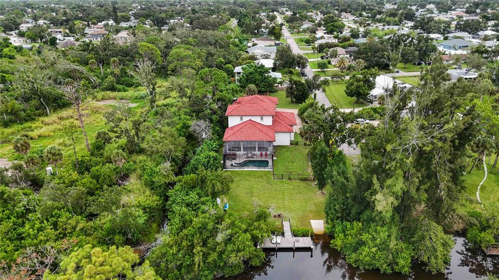 3674 Roslyn Road Venice, FL 34293 - Photo 66 of 72 an aerial view of a house with a yard