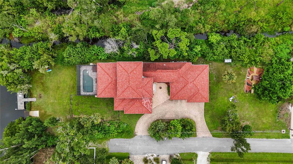 3674 Roslyn Road Venice, FL 34293 - Photo 68 of 72 an aerial view of a house with a yard basket ball court and outdoor seating