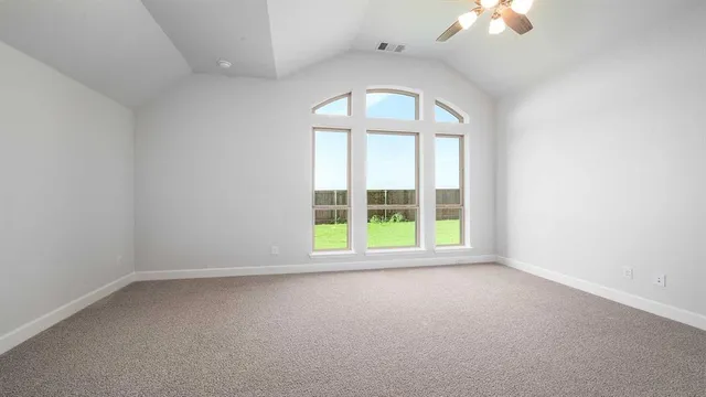 an empty room with a empty space and windows