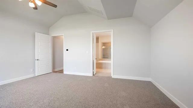 an empty room with a empty space and a ceiling fan
