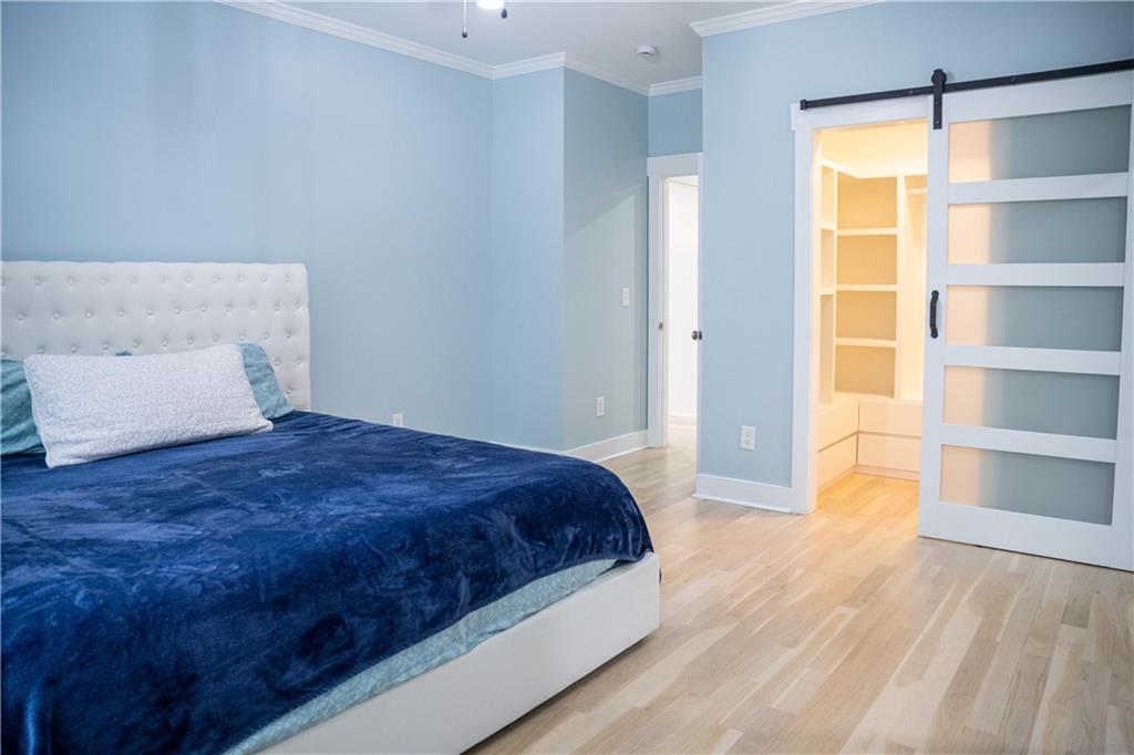 151 Cherokee Point Drive Canton, GA 30114 - Photo 114 of 163 a bedroom with a bed and a window