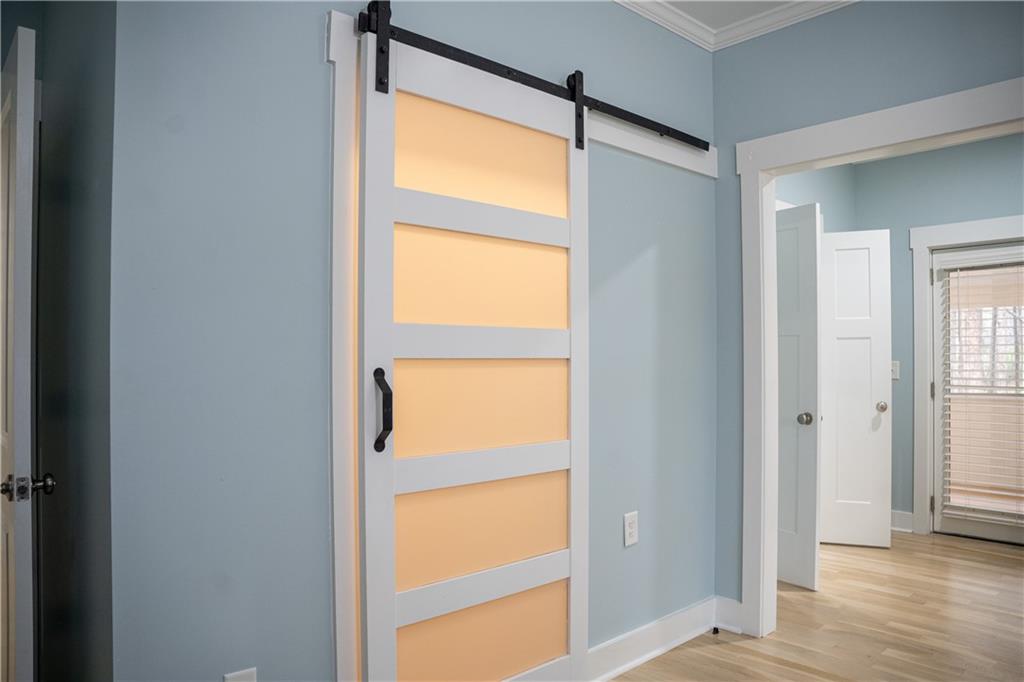 151 Cherokee Point Drive Canton, GA 30114 - Photo 116 of 163 a view of an empty room with wooden floor and a window