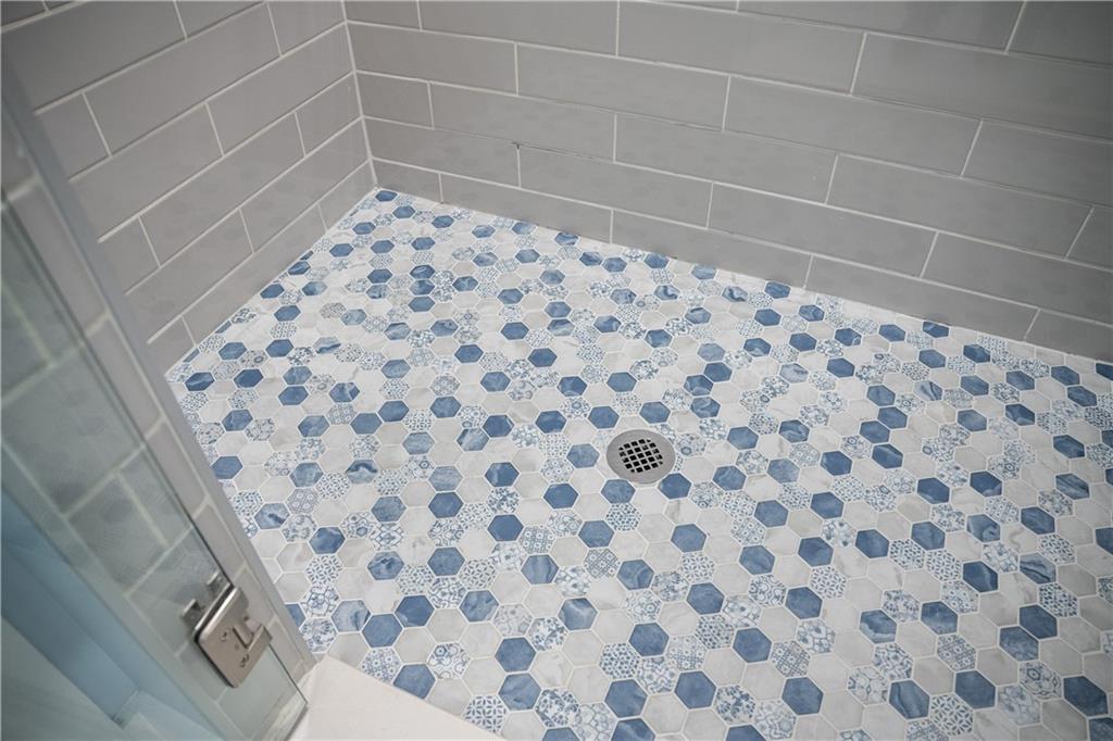 151 Cherokee Point Drive Canton, GA 30114 - Photo 132 of 163 a bathroom with a shower and a sink