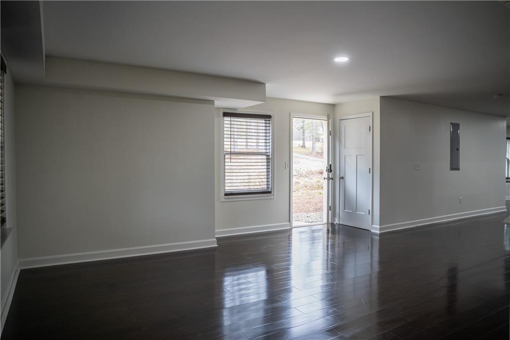 151 Cherokee Point Drive Canton, GA 30114 - Photo 146 of 163 an empty room with wooden floor and windows