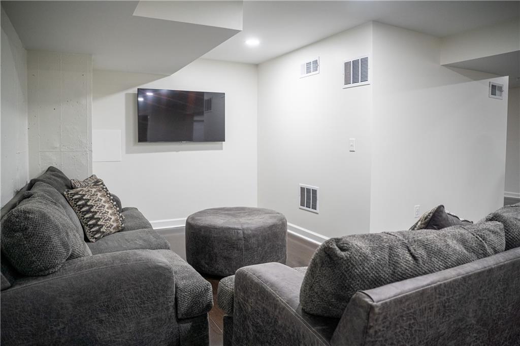 151 Cherokee Point Drive Canton, GA 30114 - Photo 155 of 163 a living room with a couch