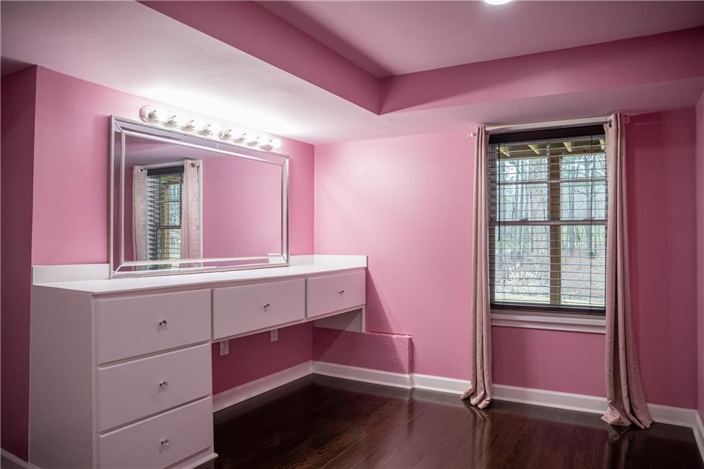 151 Cherokee Point Drive Canton, GA 30114 - Photo 162 of 163 a bathroom with a sink mirror and window