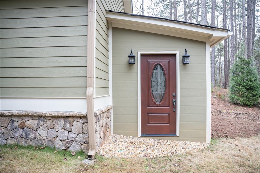 151 Cherokee Point Drive Canton, GA 30114 - Photo 24 of 163 a front view of a house with a yard