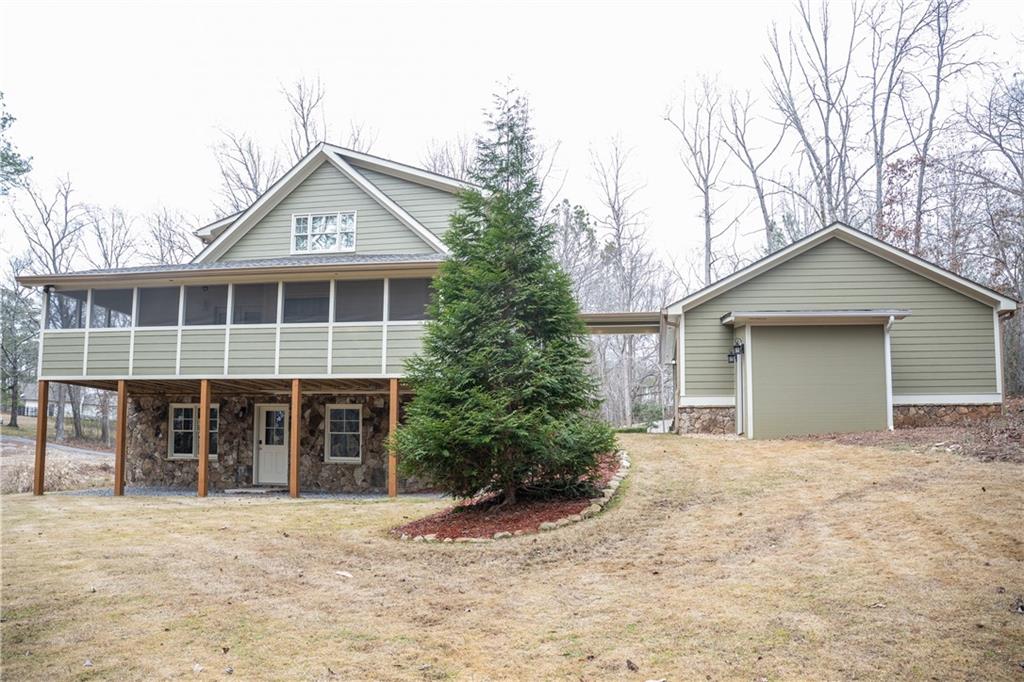 151 Cherokee Point Drive Canton, GA 30114 - Photo 29 of 163 front view of a house with a yard