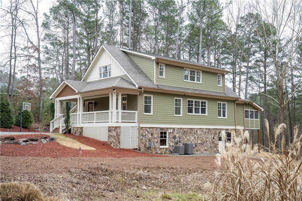151 Cherokee Point Drive Canton, GA 30114 - Photo 3 of 163 a front view of a house with a yard