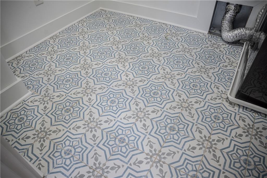 151 Cherokee Point Drive Canton, GA 30114 - Photo 54 of 163 a bathroom with a toilet and a shower curtain