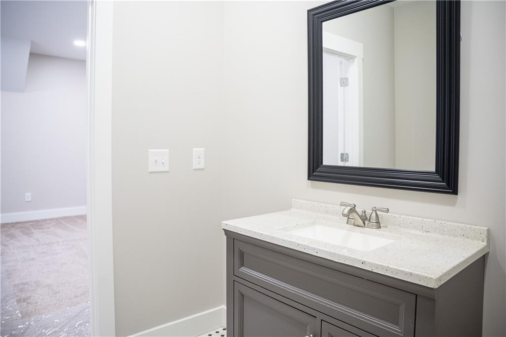 151 Cherokee Point Drive Canton, GA 30114 - Photo 59 of 163 a bathroom with a sink and a mirror