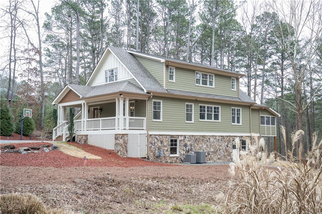 151 Cherokee Point Drive Canton, GA 30114 - Photo 6 of 163 a front view of a house with a yard and garage