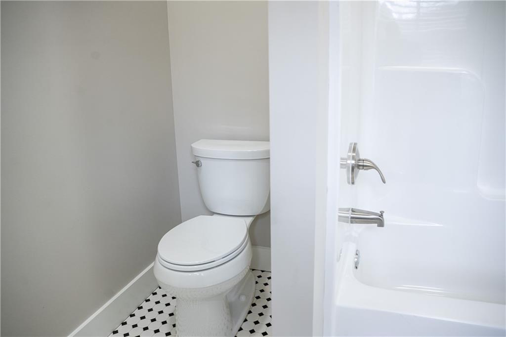 151 Cherokee Point Drive Canton, GA 30114 - Photo 61 of 163 a white toilet sitting next to a white tub