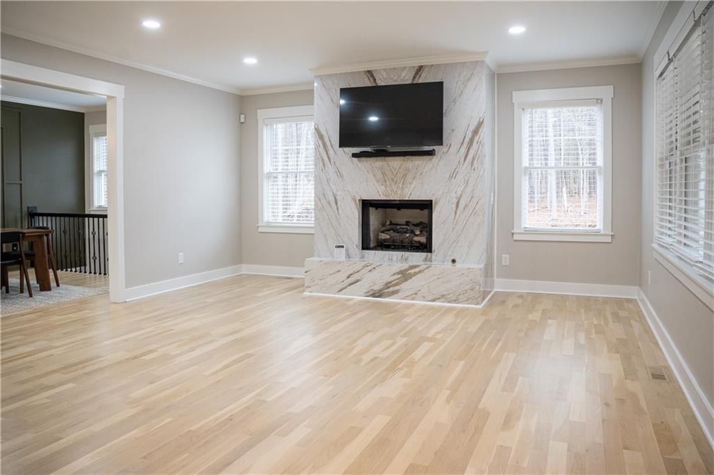 151 Cherokee Point Drive Canton, GA 30114 - Photo 76 of 163 an empty room with windows fireplace and television