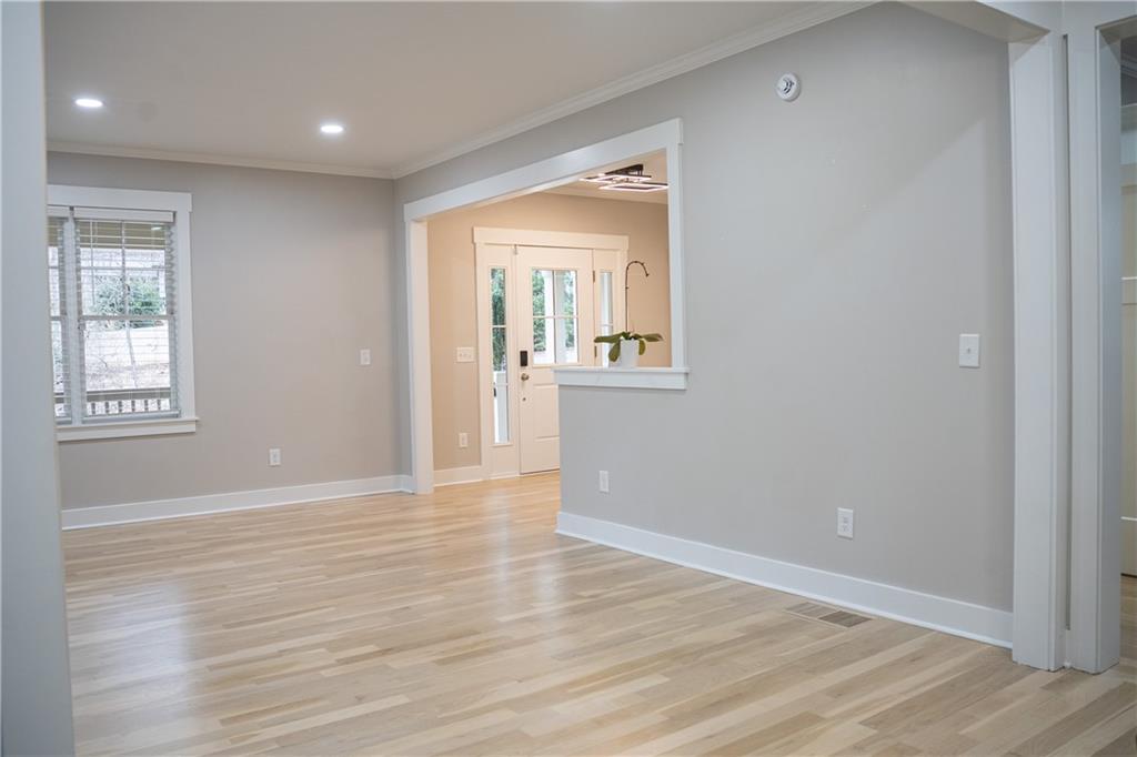 151 Cherokee Point Drive Canton, GA 30114 - Photo 78 of 163 a view of an empty room with wooden floor and a window