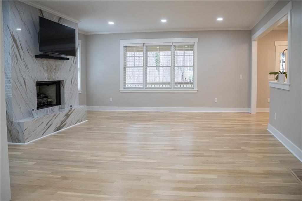 151 Cherokee Point Drive Canton, GA 30114 - Photo 79 of 163 a view of livingroom with kitchen and fireplace