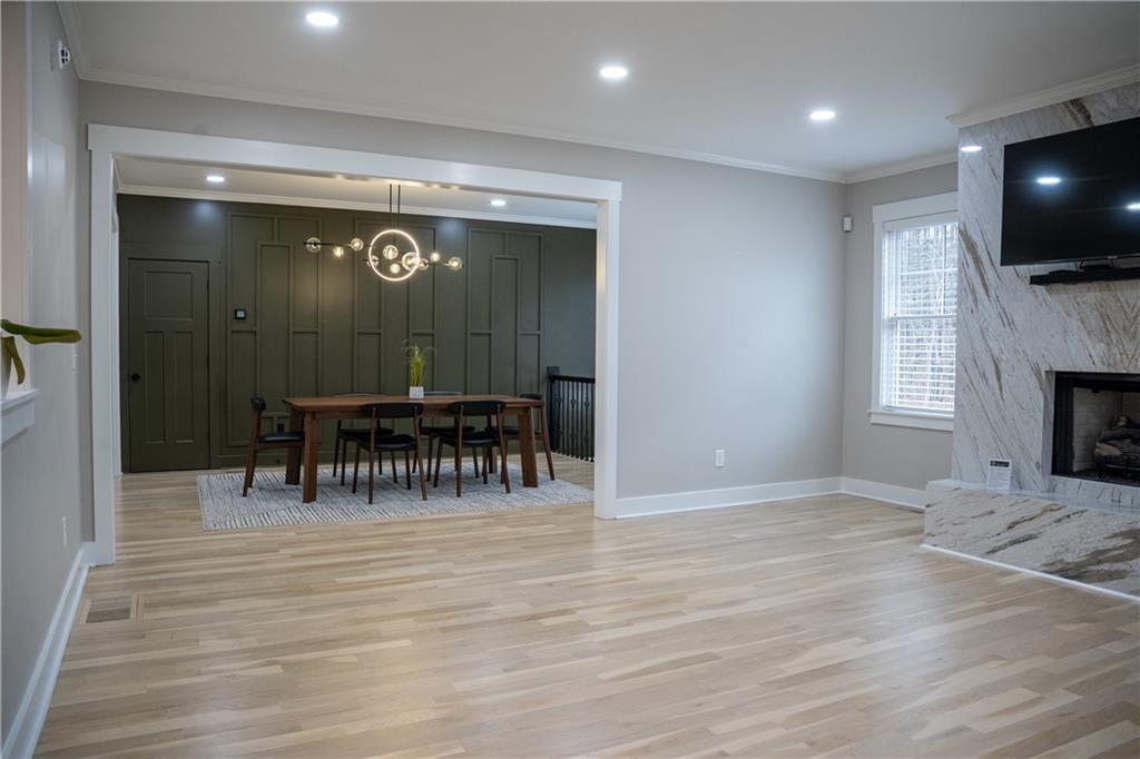 151 Cherokee Point Drive Canton, GA 30114 - Photo 82 of 163 a view of a livingroom with furniture and a flat screen tv