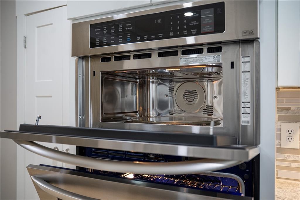 151 Cherokee Point Drive Canton, GA 30114 - Photo 93 of 163 a stove top oven sitting inside of a kitchen