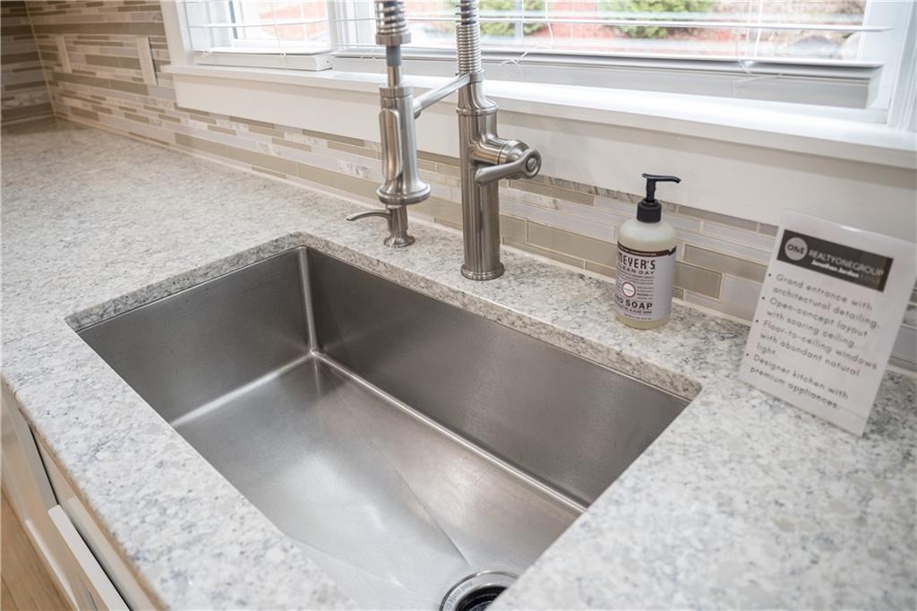 151 Cherokee Point Drive Canton, GA 30114 - Photo 100 of 163 a kitchen with a sink and a window