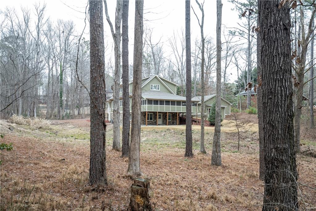 151 Cherokee Point Drive Canton, GA 30114 - Photo 10 of 163 a view of a house with a tree in the yard