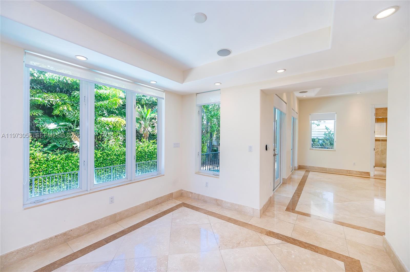 541 South Mashta Drive Key Biscayne, FL 33149 - Photo 13 of 28 a view of an empty room with wooden floor and a window