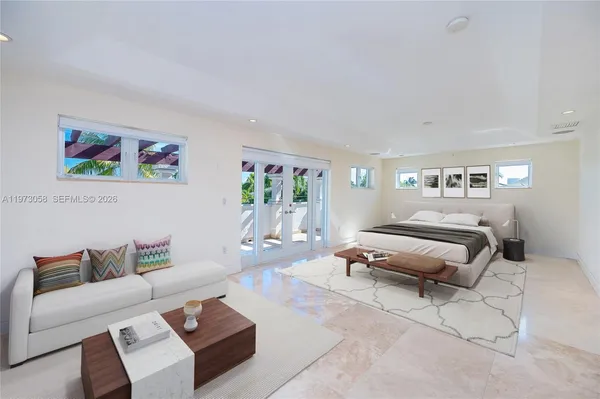 a spacious bathroom with a tub sink and mirror