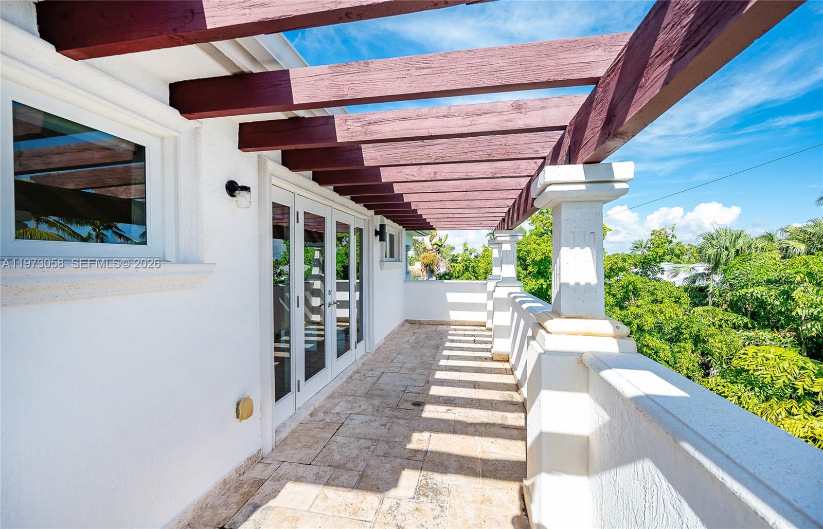 541 South Mashta Drive Key Biscayne, FL 33149 - Photo 17 of 28 a view of a backyard with garden and patio