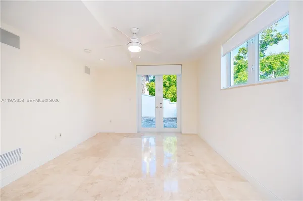 a bathroom with a granite countertop sink mirror and double
