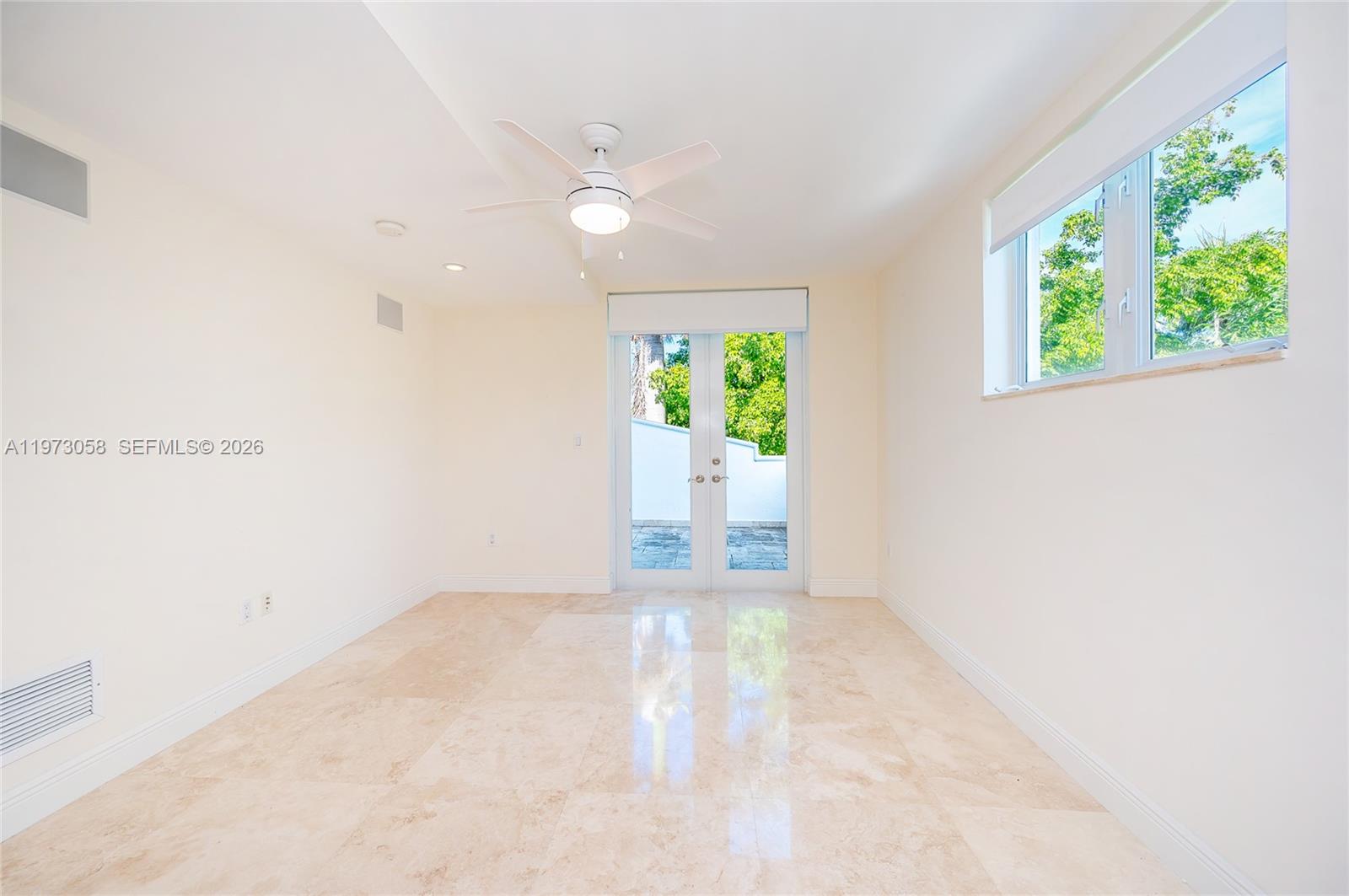 541 South Mashta Drive Key Biscayne, FL 33149 - Photo 20 of 28 a view of an empty room with a window