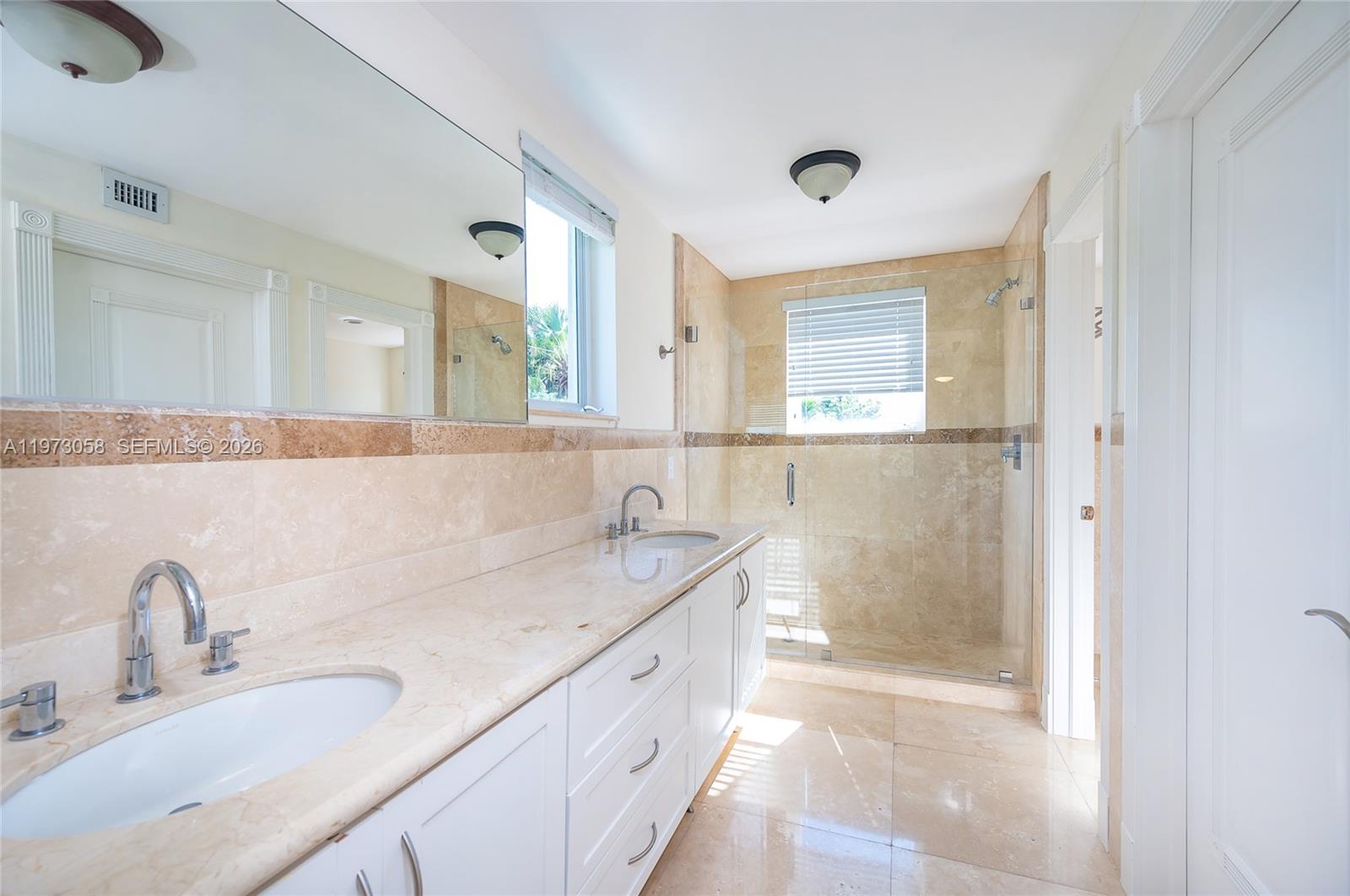 541 South Mashta Drive Key Biscayne, FL 33149 - Photo 21 of 28 a bathroom with a granite countertop sink mirror and double