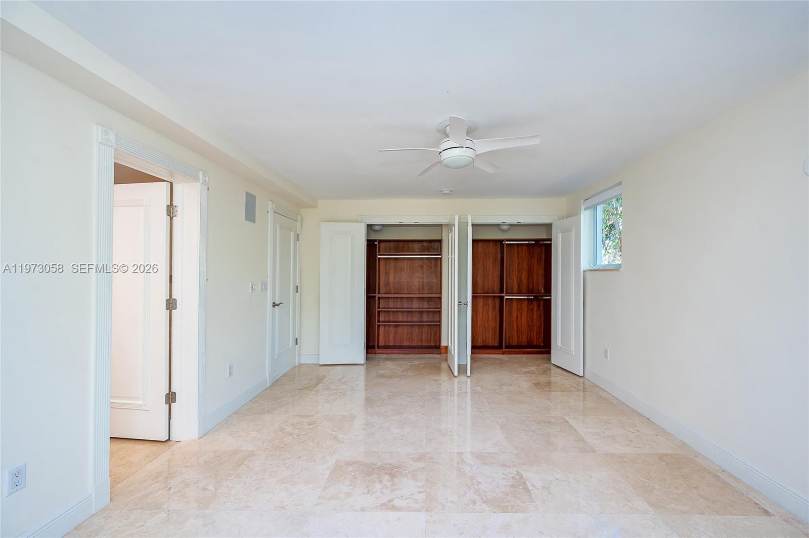 541 South Mashta Drive Key Biscayne, FL 33149 - Photo 22 of 28 an empty room with closet and windows