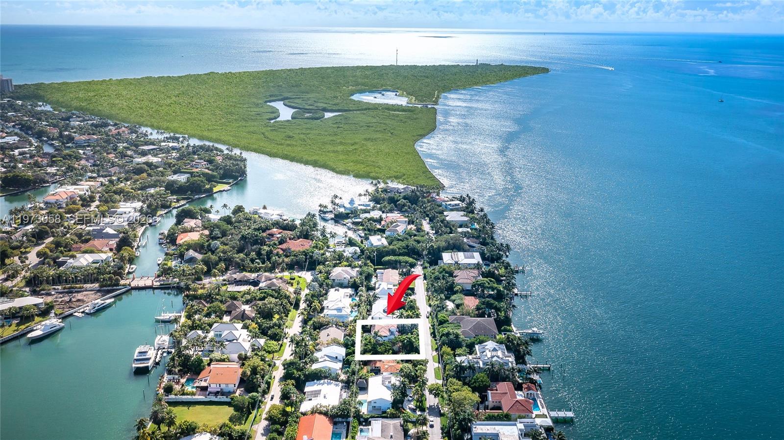 541 South Mashta Drive Key Biscayne, FL 33149 - Photo 3 of 28 a view of a lake with a big yard