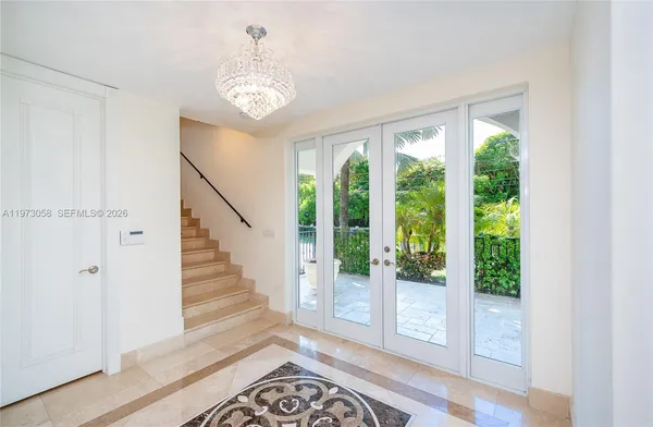 a view of an entryway with wooden floor