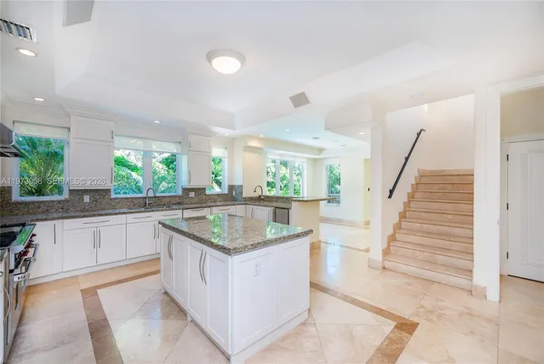 a kitchen with a sink and center island