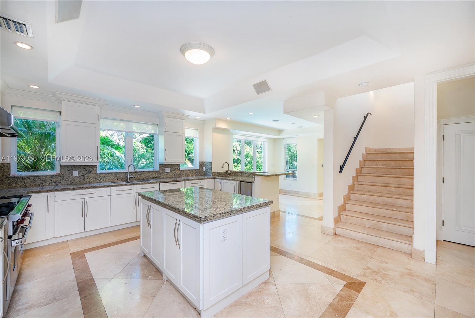 541 South Mashta Drive Key Biscayne, FL 33149 - Photo 10 of 28 a kitchen with a sink and center island